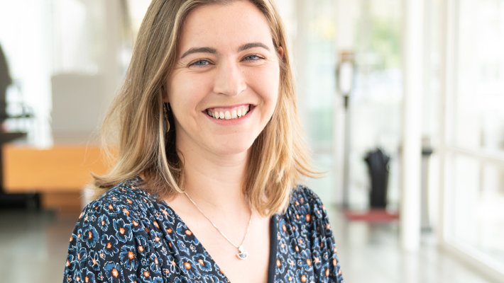 A person smiles for a photo