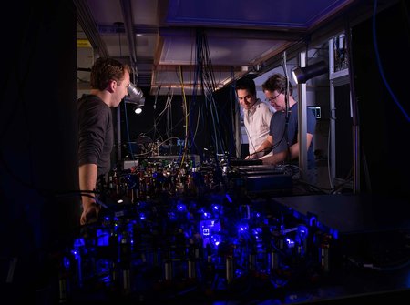 Adam Shaw, Ivaylo Madjarov, and Manuel Endres in the lab.
