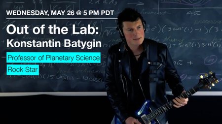Konstantin Batygin playing guitar in front of a chalkboard full of equations